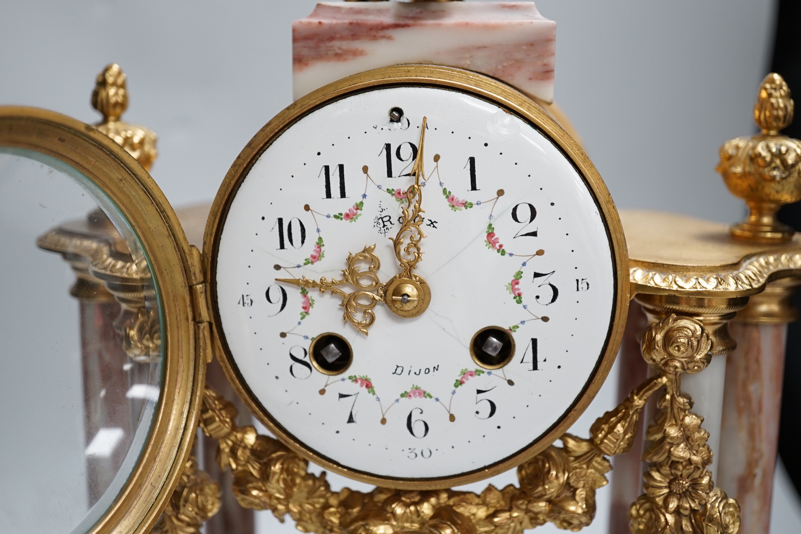 An early 20th century French gilt-metal and marble clock garniture, 38cm high